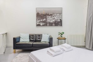 Apartment | Laptop workspace, iron/ironing board, bed sheets