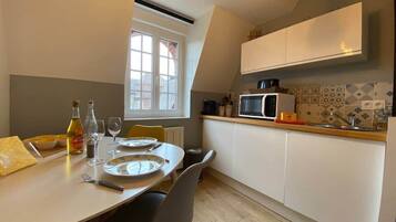 Fridge, microwave, cookware/dishes/utensils