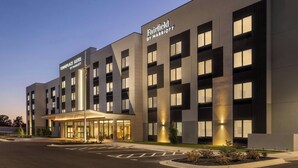 A modern hotel with a prominent marquee sign, a covered entrance, and a well-lit facade. - Fairfield by Marriott Inn & Suites Forrest City (Forrest City)