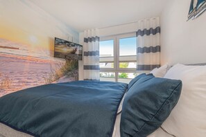 2 habitaciones, tabla de planchar con plancha y cuna de viaje 