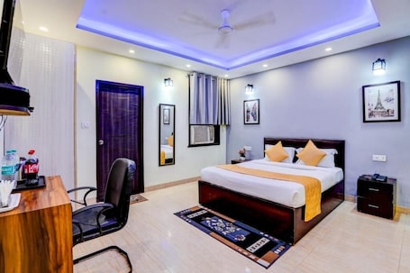 Desk, laptop workspace, blackout drapes, iron/ironing board. Hotel maayra inn