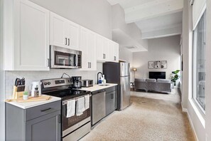 Fridge, microwave, oven, stovetop - Spacious 2BR CozySuites OTR Downtown #07 (Cincinnati)