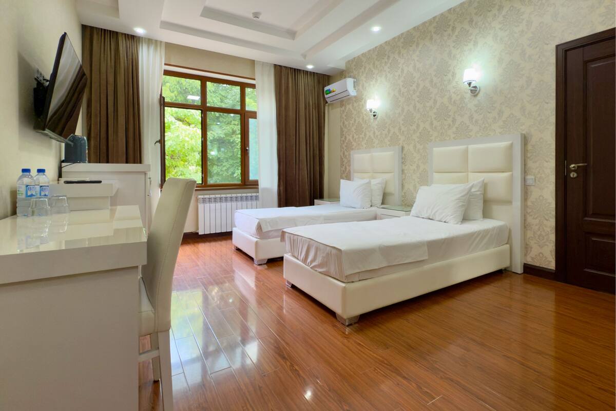 Standard Quadruple Room, Garden View | Desk, laptop workspace, free WiFi