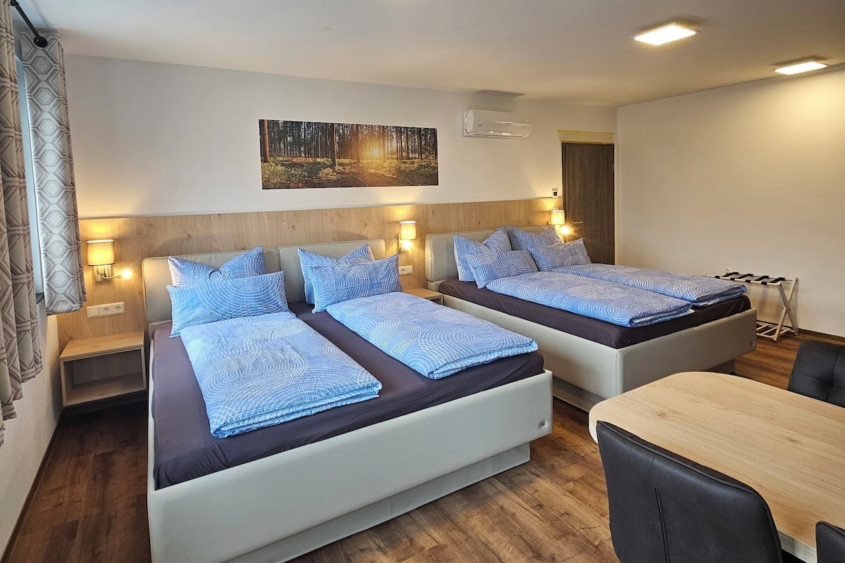 Family Quadruple Room, Balcony | In-room safe, individually decorated, individually furnished
