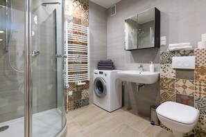 Shower, hair dryer, towels, soap