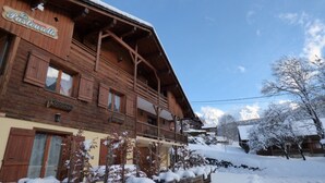 A wooden building with a sign that reads "La Pastourella."