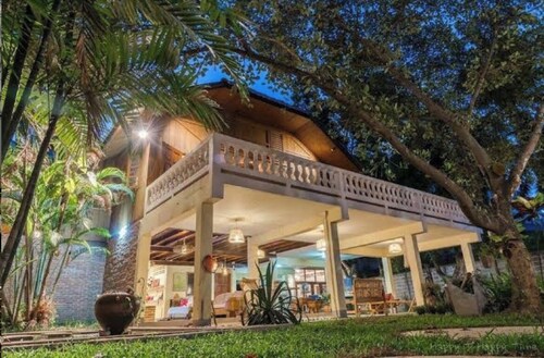 Stay in Style: Cozy AC Room, Tropical Garden & Prime Location.