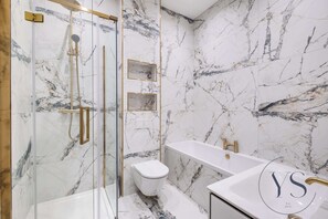 Shower, hair dryer, towels, shampoo