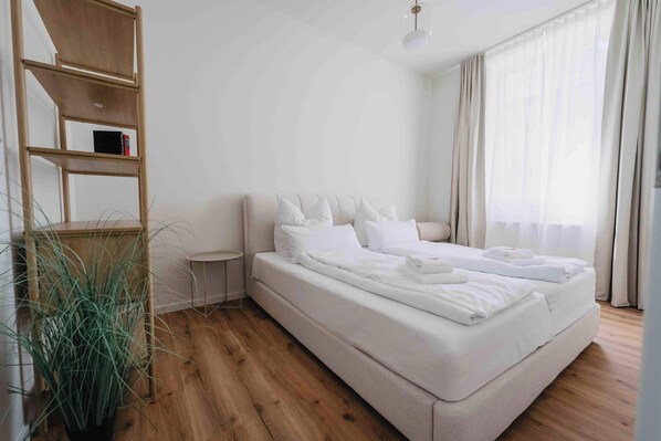 1 bedroom, desk, iron/ironing board, travel crib