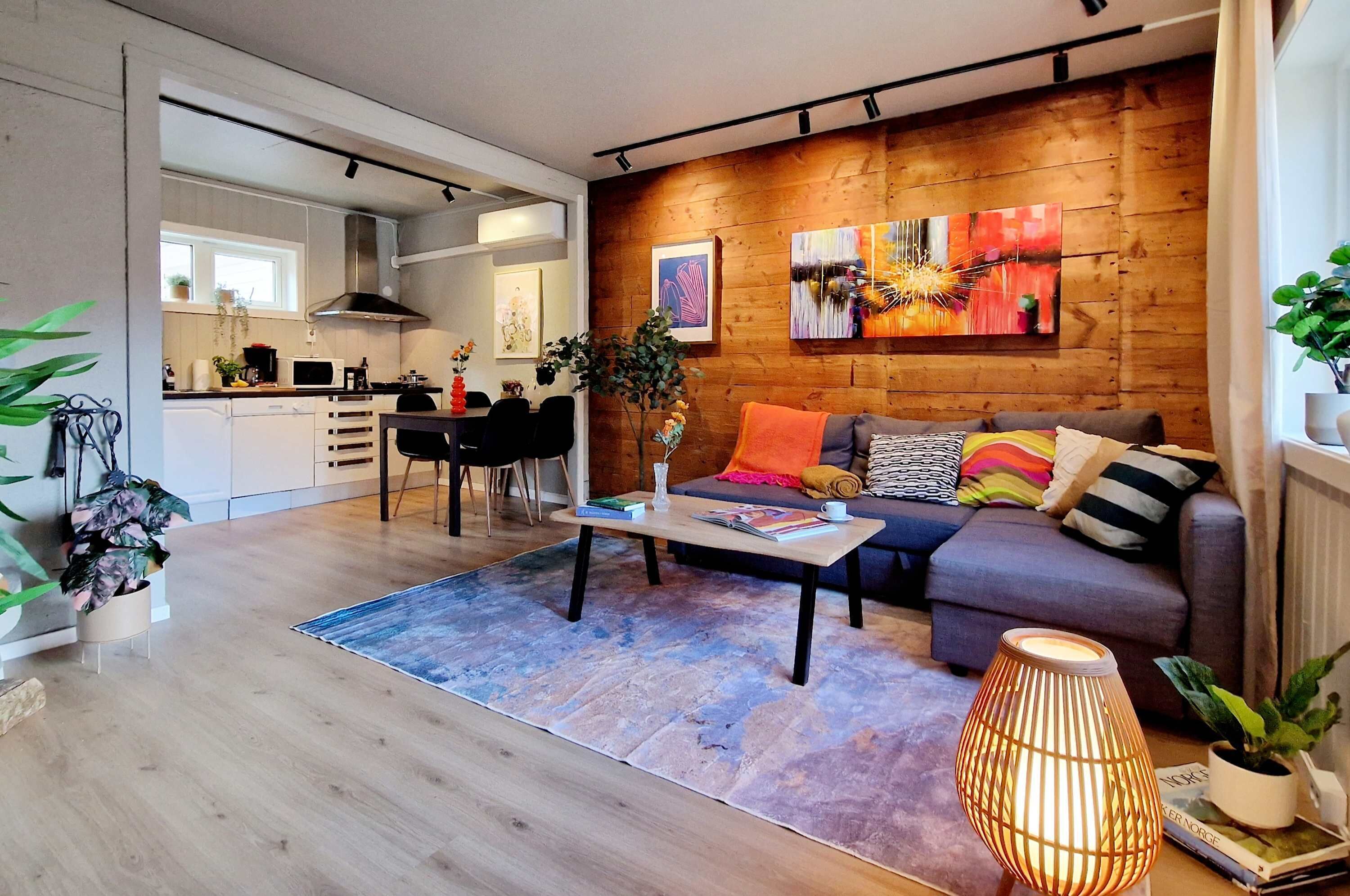 Living space with fireplace, TV, cozy adjustable lighting, and a nice view to the area. Send us a message about the apartment, area, or recommendations for Bergen