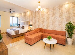 Superior Studio Suite | Minibar, in-room safe, laptop workspace, blackout drapes
