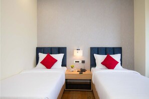 Superior Twin Room, City View | Minibar, in-room safe, laptop workspace, blackout drapes