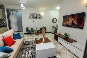 58-inch Smart TV with cable channels - The Nest Kampala (Kampala)