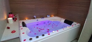 Jetted tub, hair dryer, towels, soap