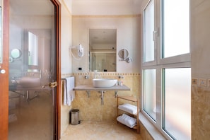 Suite, Balcony, City View | Bathroom | Hair dryer, towels, soap, shampoo