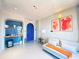 Luxury Suite, 1 King Bed with Sofa bed, Balcony, Beach View | Living area | 55-inch Smart TV with digital channels