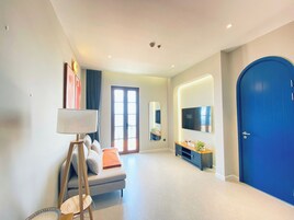 Luxury Suite, 1 King Bed with Sofa bed, Balcony, Beach View | Living area | 55-inch Smart TV with digital channels