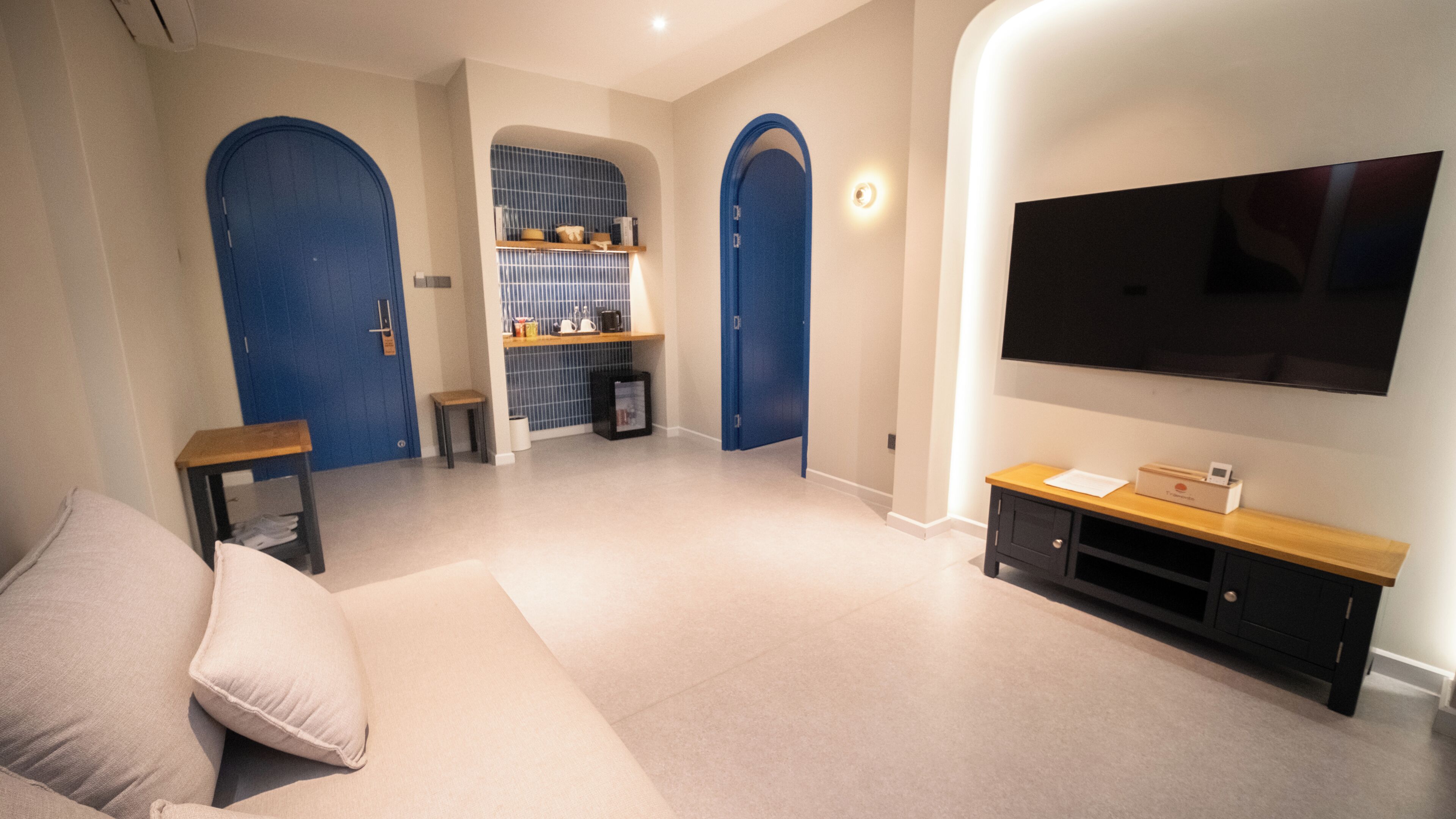 Luxury Suite, 1 King Bed with Sofa bed, Balcony, City View | Living area | 55-inch Smart TV with digital channels