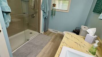 Shower, hair dryer, towels, soap