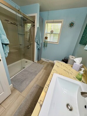 Shower, hair dryer, towels, soap