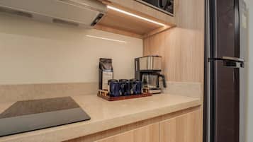 Fridge, microwave, stovetop, coffee/tea maker