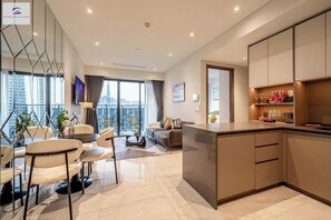 Deluxe Apartment, 2 Bedrooms, Non Smoking, City View | Living area | 24-inch TV with cable channels, books, music library - The Metropole Opera Deluxe Residence (Ho Chi Minh)