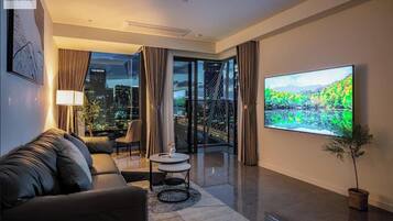 Royal Apartment, 3 Bedrooms, River View, Courtyard Area | Living area | 24-inch TV with cable channels, books, music library