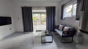 Deluxe Double Room | Living room | 32-inch Smart TV with digital channels