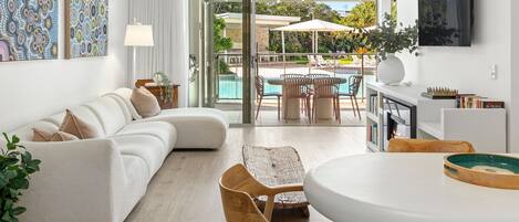 TV, fireplace, books