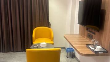 Luxury Suite, City View | Living area | 32-inch LED TV with cable channels, iPod dock, pay movies