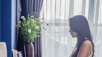 Deluxe Studio, 1 King Bed, Partial Ocean View | Living area | 32-inch LCD TV with cable channels