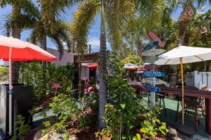 Outdoor dining - Pet Friendly 3BR W/ Tropical Views, Porch & Heated Pool (Holmes Beach)