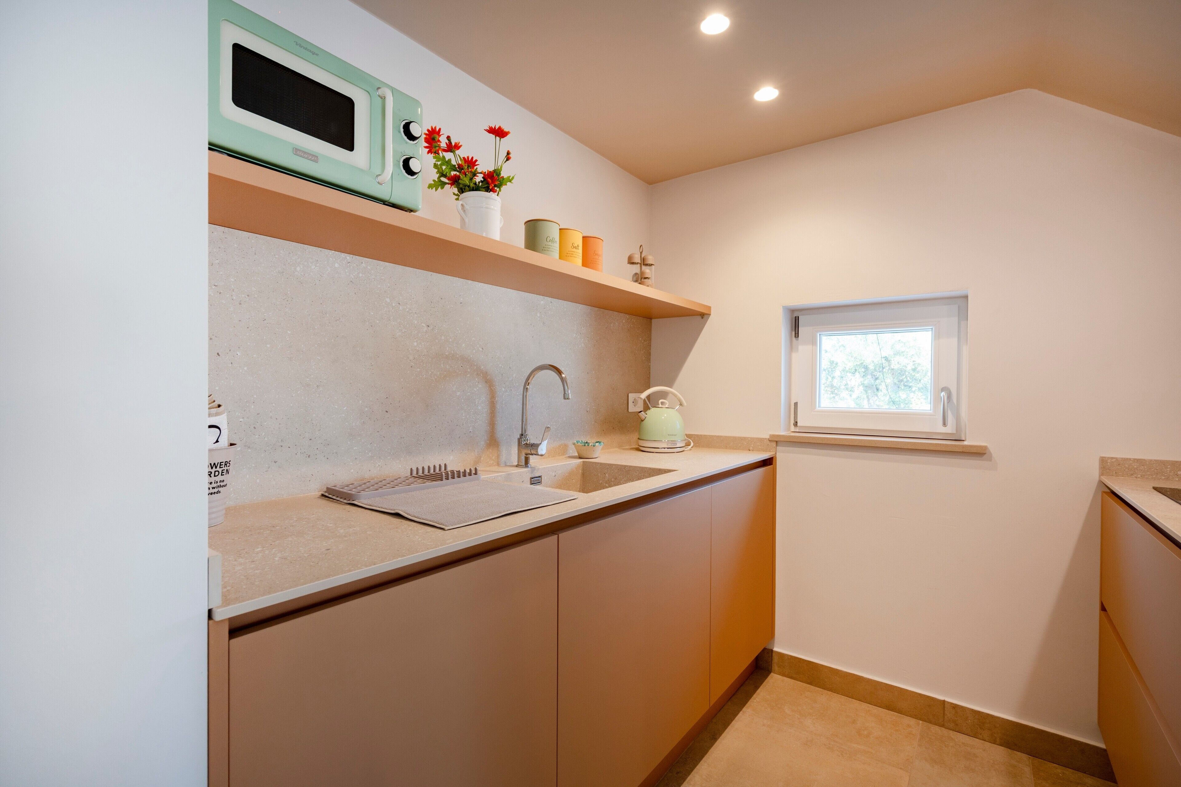 Fridge, dishwasher, coffee/tea maker, cookware/dishes/utensils