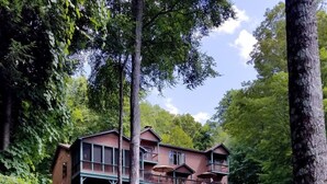 A two-story lodge with a covered walkway and multiple balconies.