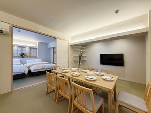 Japanese-style Apartment | Living area | 55-inch Smart TV with cable channels - bHotel Miyajima Omotesando 22 (Hatsukaichi)