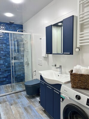 Hair dryer, towels, soap, toilet paper
