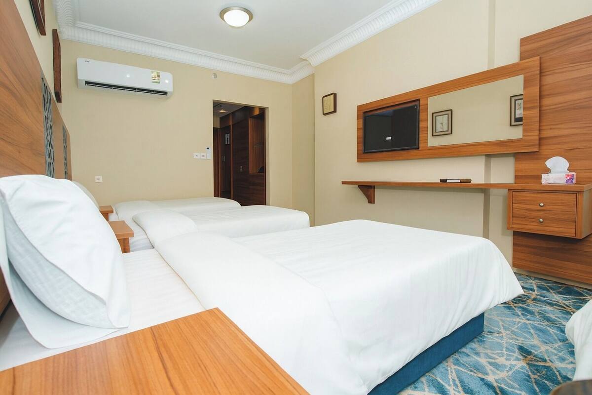 Deluxe Triple Room | Hypo-allergenic bedding available, minibar, desk, laptop workspace