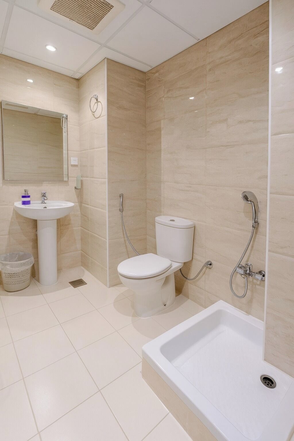 Shower, hair dryer, slippers, towels