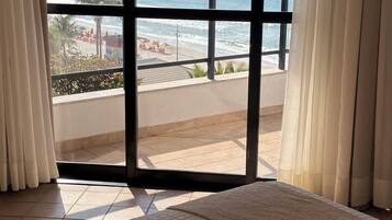 Deluxe Room, Balcony, Beach View | In-room safe, blackout curtains, free WiFi, bed sheets