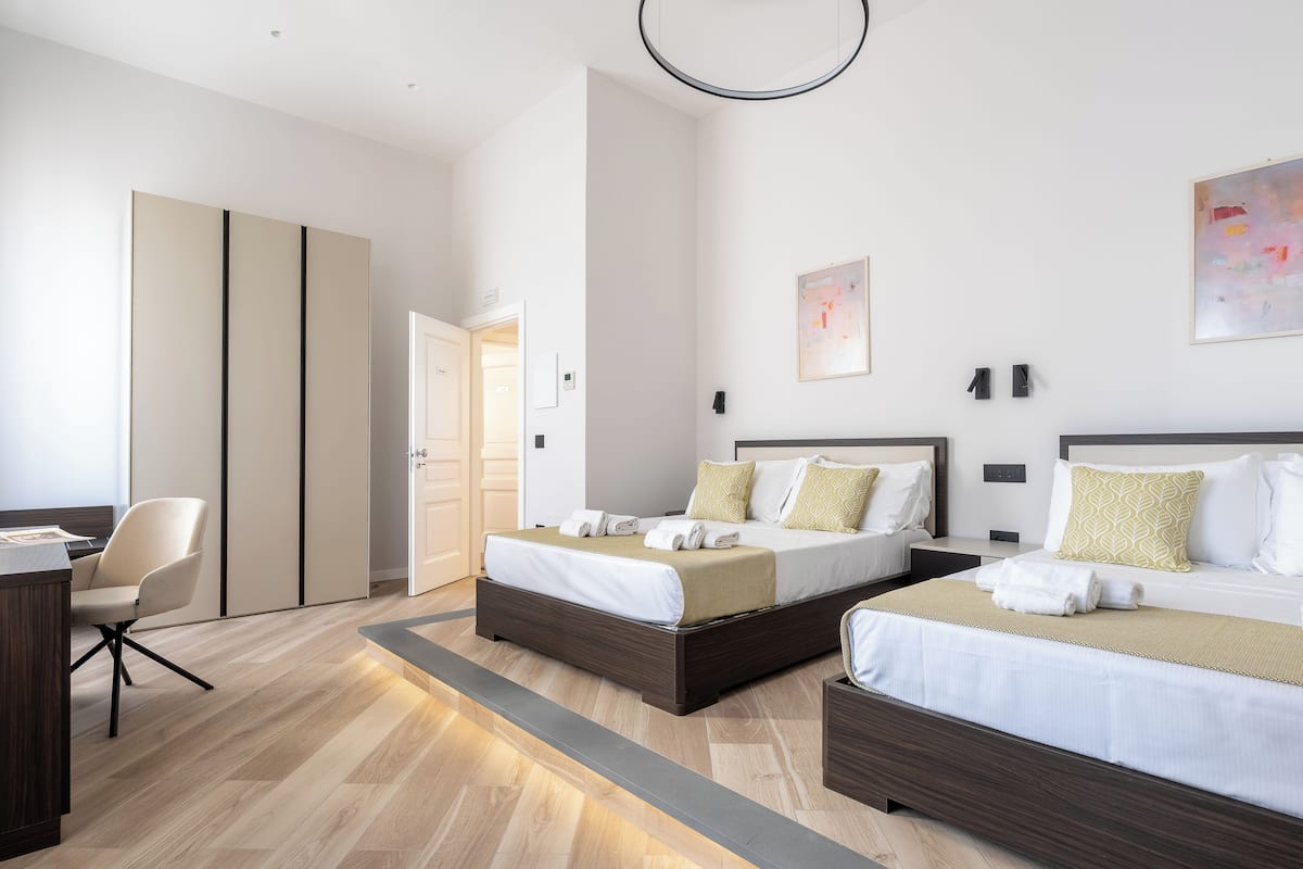 Deluxe Quadruple Room | Desk, laptop workspace, free WiFi
