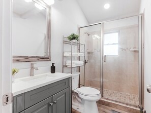 Shower, towels, soap, toilet paper
