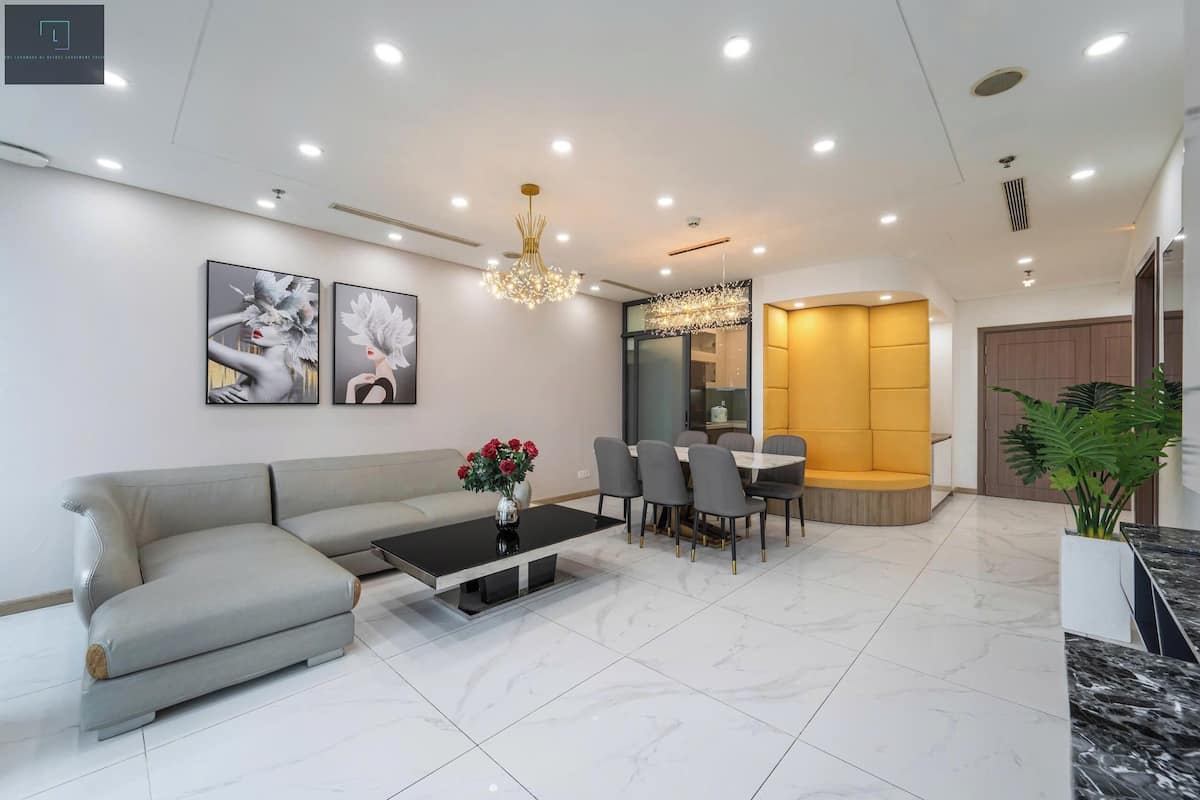 Deluxe Apartment, 4 Bedrooms, Non Smoking, City View | Living area | 16-inch TV with cable channels, books