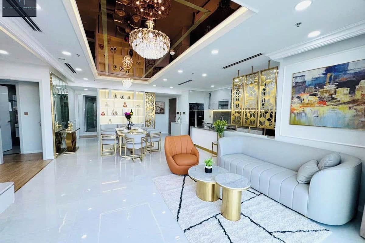 Deluxe Apartment, 4 Bedrooms, Non Smoking, City View | Living area | 16-inch TV with cable channels, books