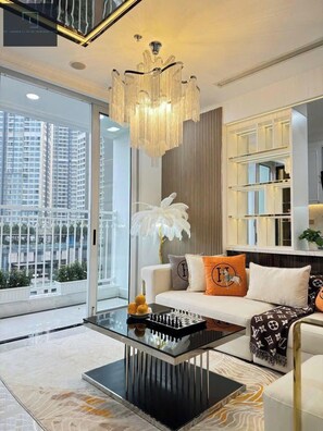 Premium Apartment, 3 Bedrooms, Non Smoking, City View | Living area | 16-inch TV with cable channels, books