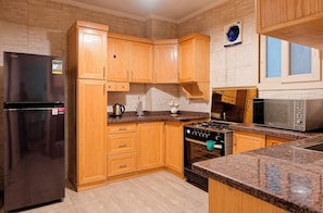 Fridge, microwave, oven, dining tables
