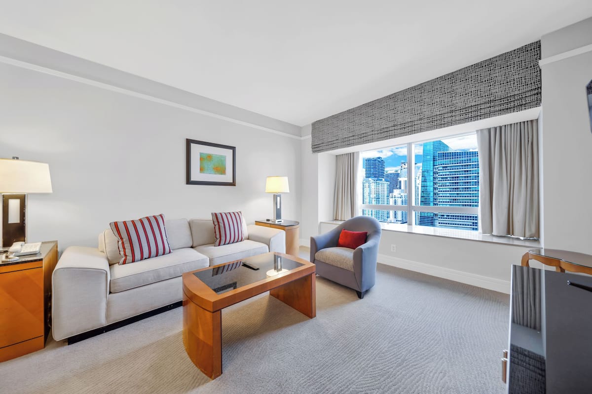 Superior Suite, Partial Ocean View | In-room safe, desk, laptop workspace, free WiFi