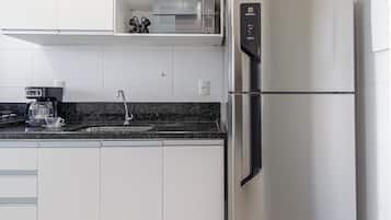 Fridge, microwave, cookware/dishes/utensils