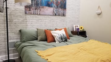 1 bedroom, desk, iron/ironing board, travel crib