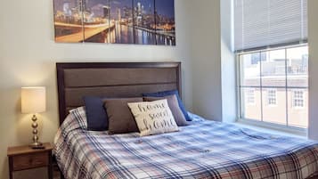 1 bedroom, desk, iron/ironing board, travel crib