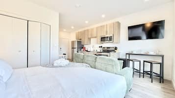 1 bedroom, desk, iron/ironing board, travel crib